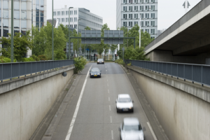 3 Cars driving over bridge