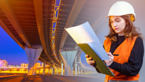 Female contractor standing underneath bridge 